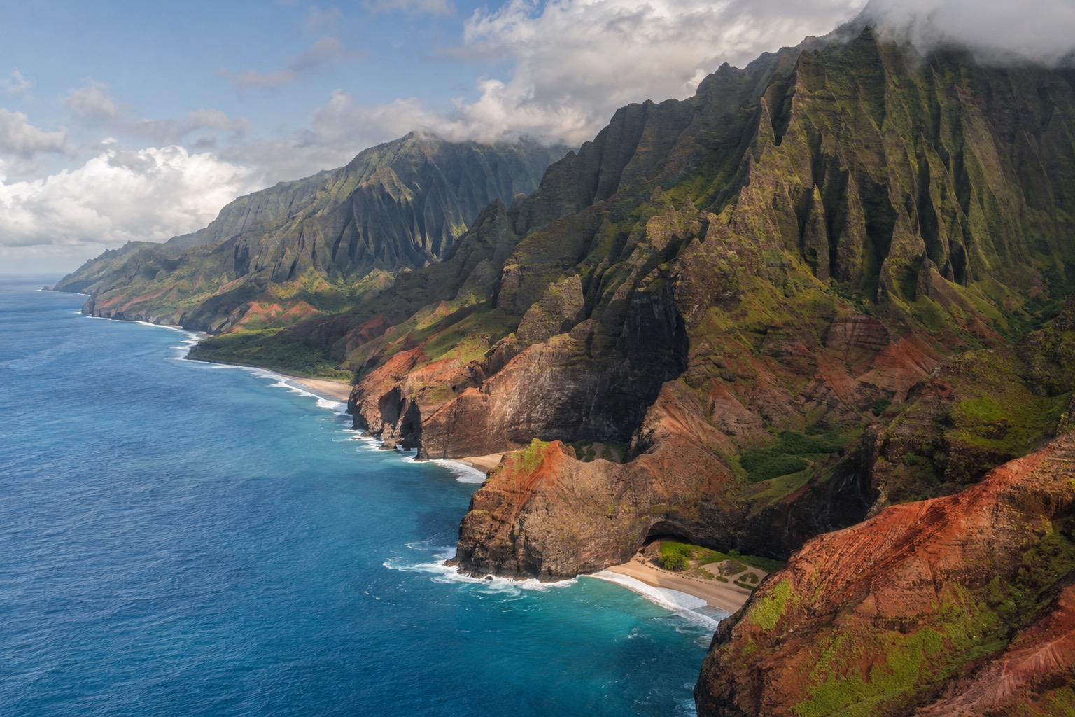 Green fluted cliffs of the Napali Coast dropping into the Pacific