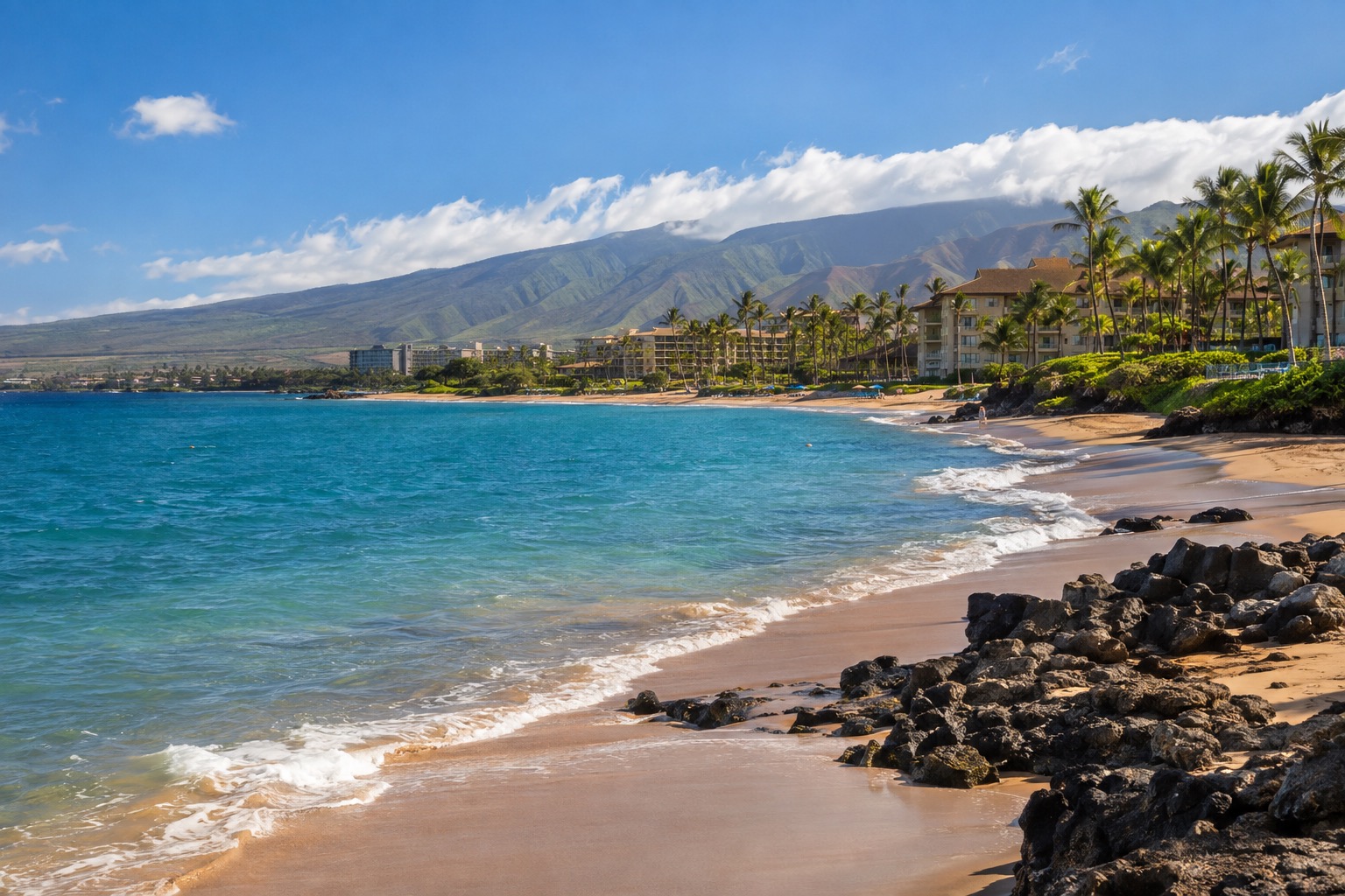 Palm-lined beach and resort towers along Kaanapali on Maui's leeward coast