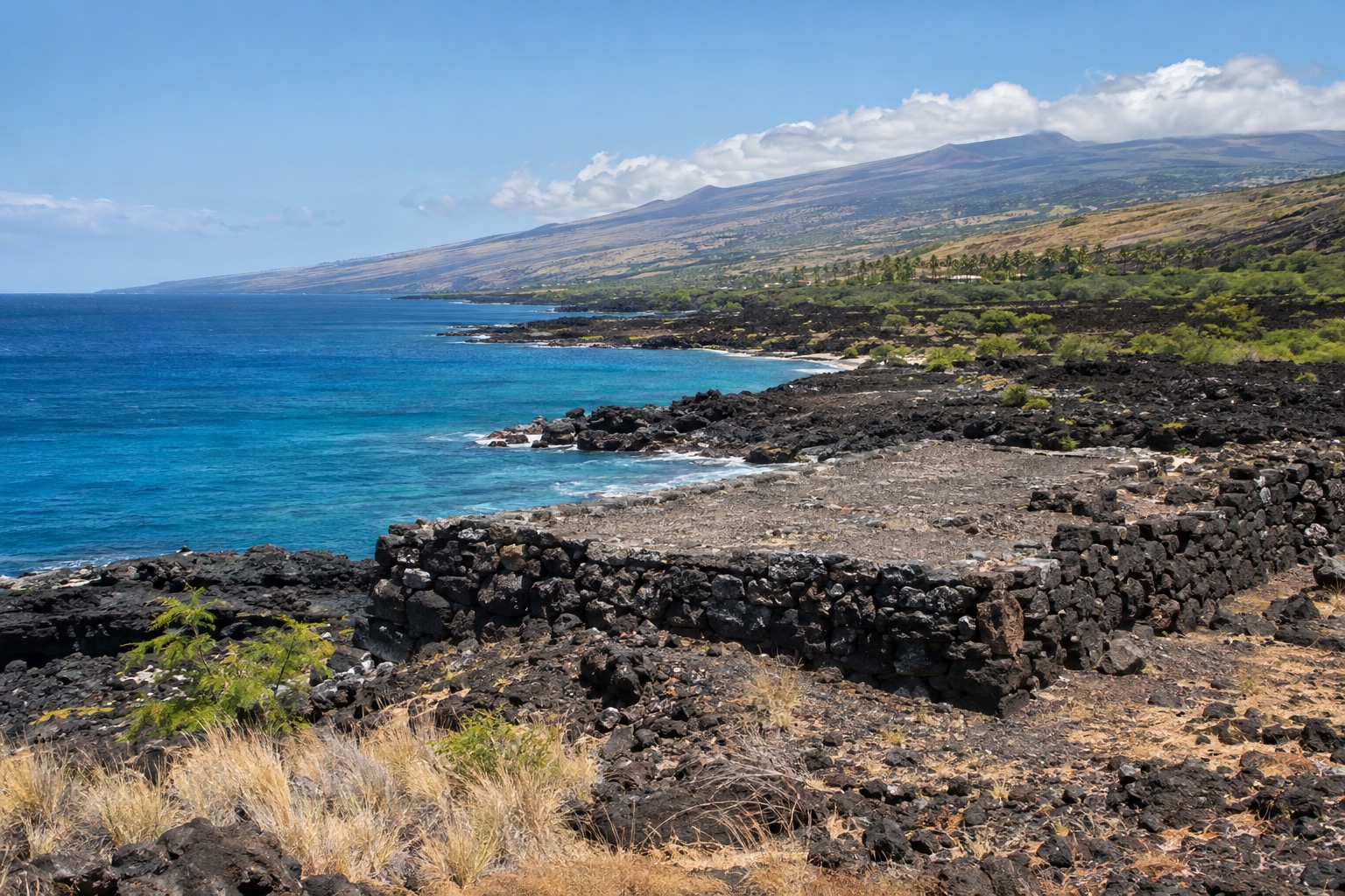Stone platform of an ancient Hawaiian heiau overlooking the Kohala coastline