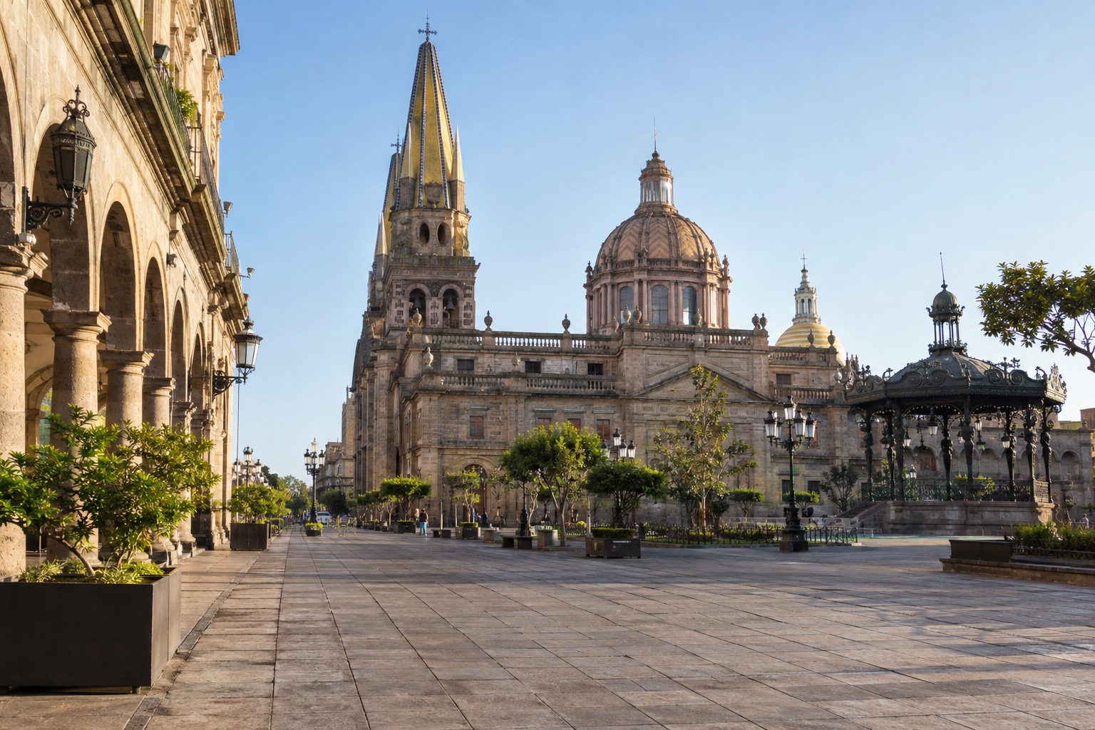 Historic center of Guadalajara at morning with a tiled plaza and a cathedral in the background