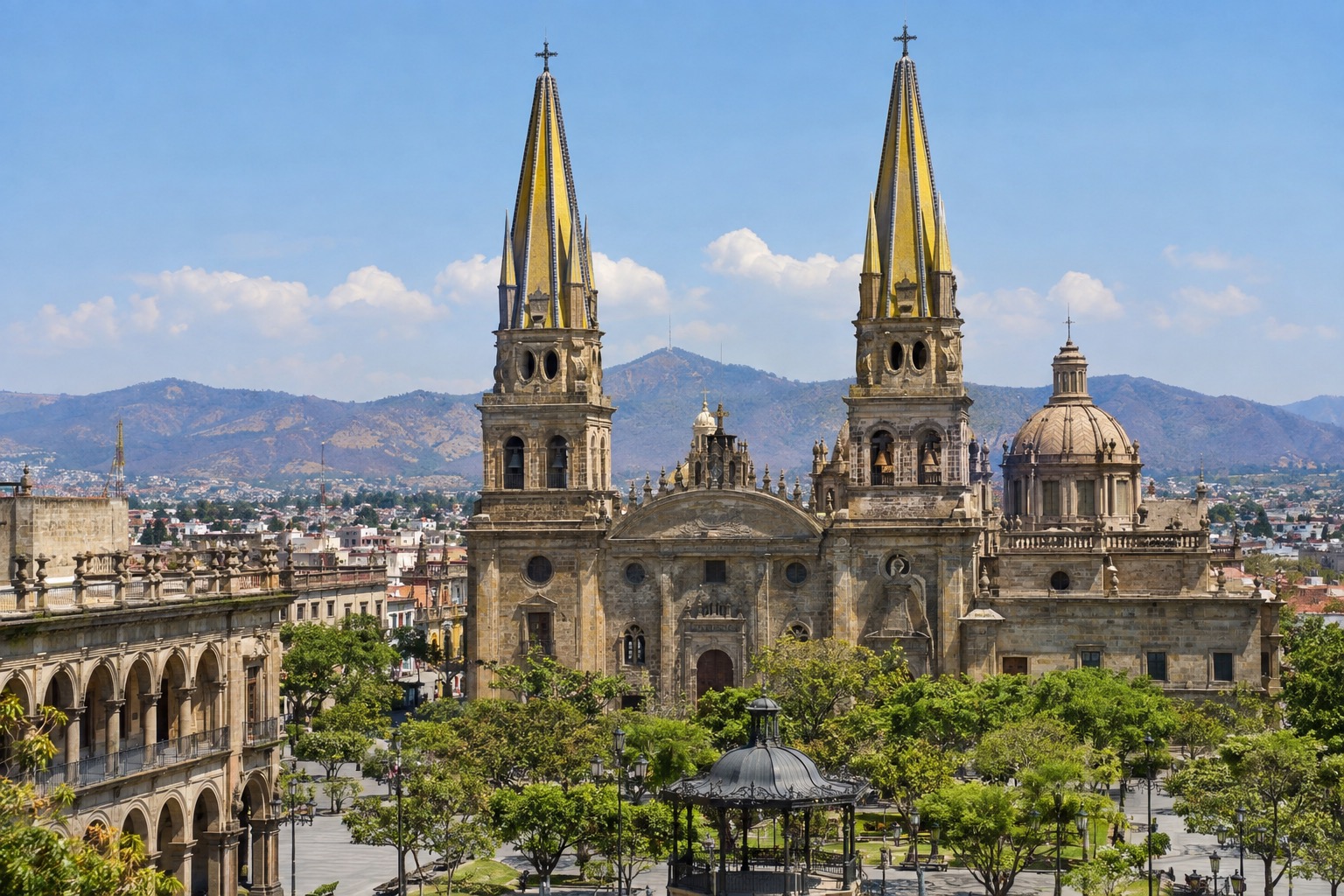 Twin yellow-tiled cathedral spires rising over a plaza in central Guadalajara
