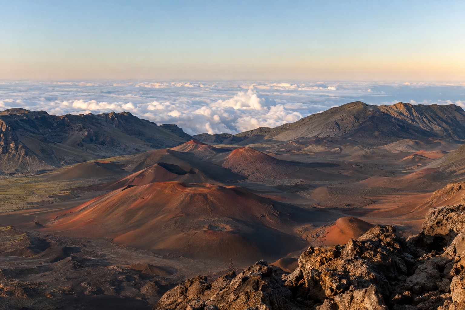 Red and black cinder cones inside Haleakala's summit crater at dawn