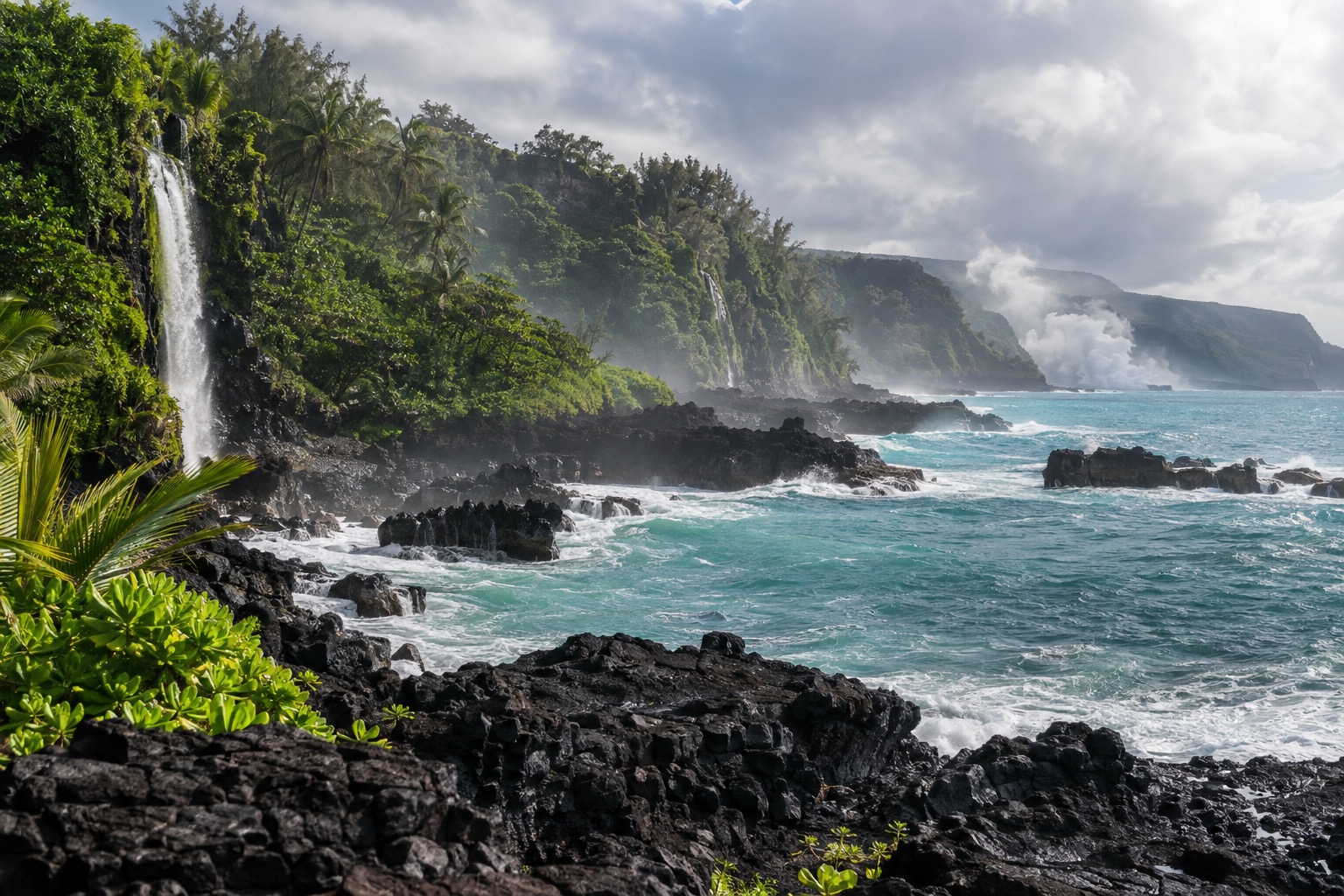 A black lava-rock coastline meeting turquoise water near Hilo