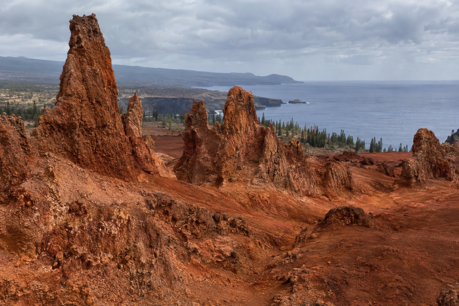 Red rock spires at Keahiakawelo on Lanai's plateau under an overcast sky