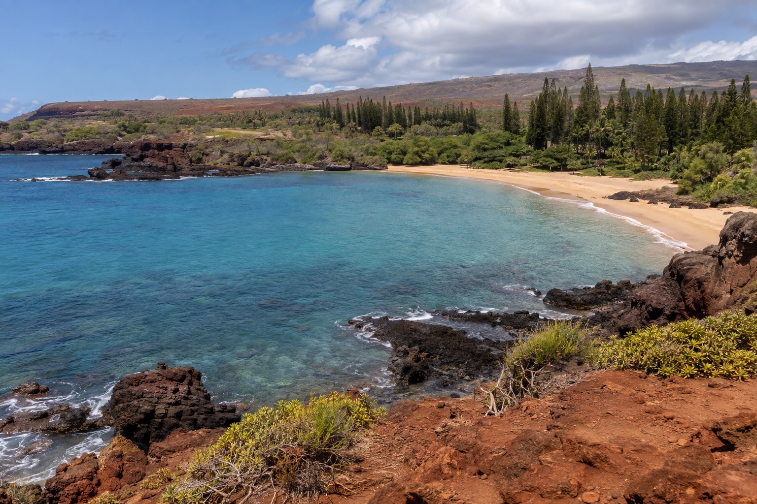 Hulopoe Bay's crescent beach and turquoise water on Lanai's south shore