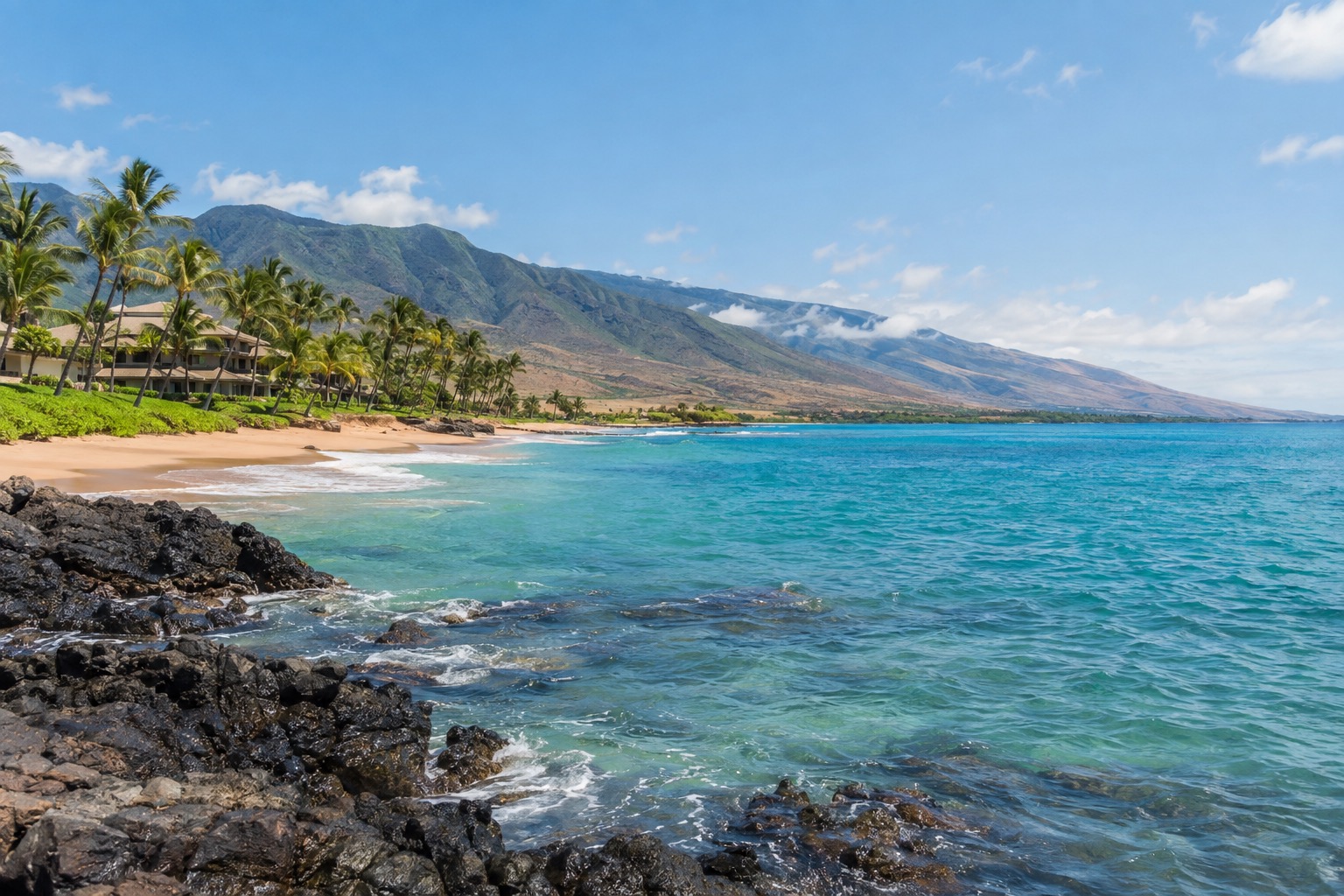 A calm turquoise bay along Maui's leeward coast under a clear September sky