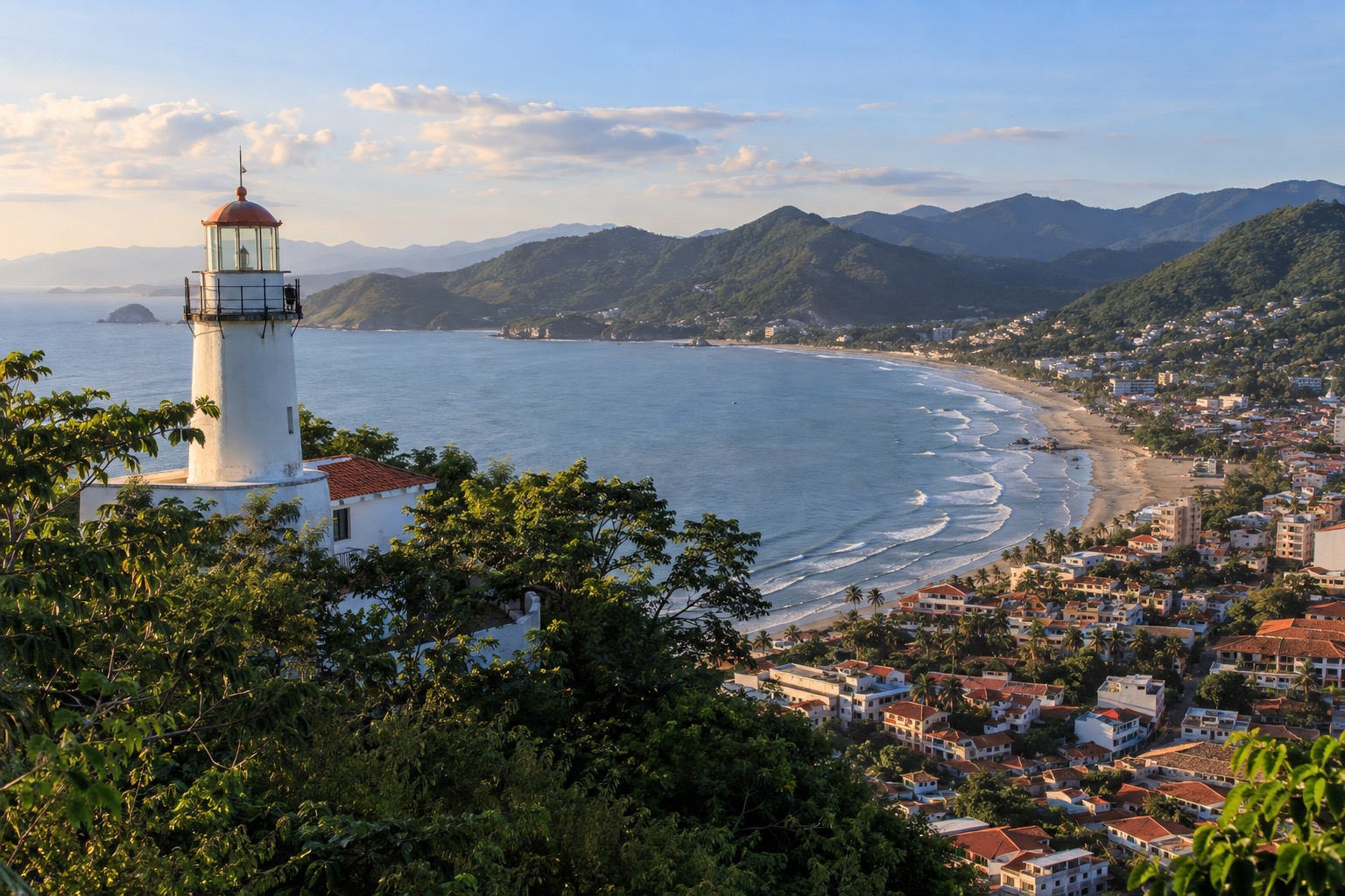 A lighthouse on a hilltop above a harbor and city on the Pacific coast of Mexico