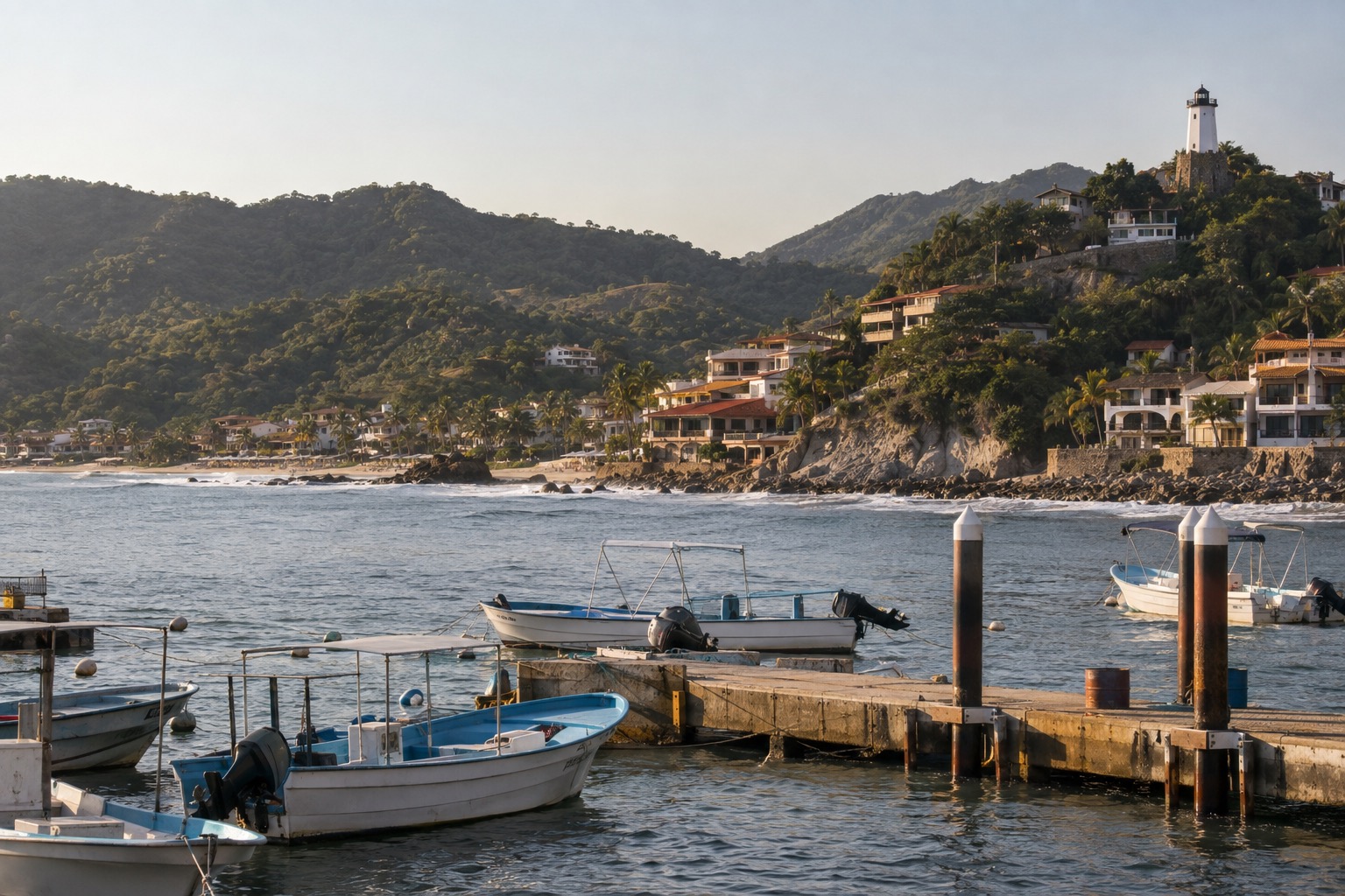 Small passenger boats moored at a pier below a hill with a lighthouse
