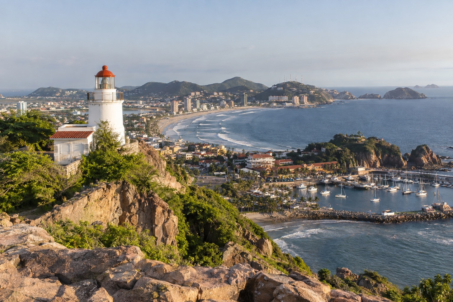 Lighthouse on a rocky hill above the coast and harbor at Mazatlan