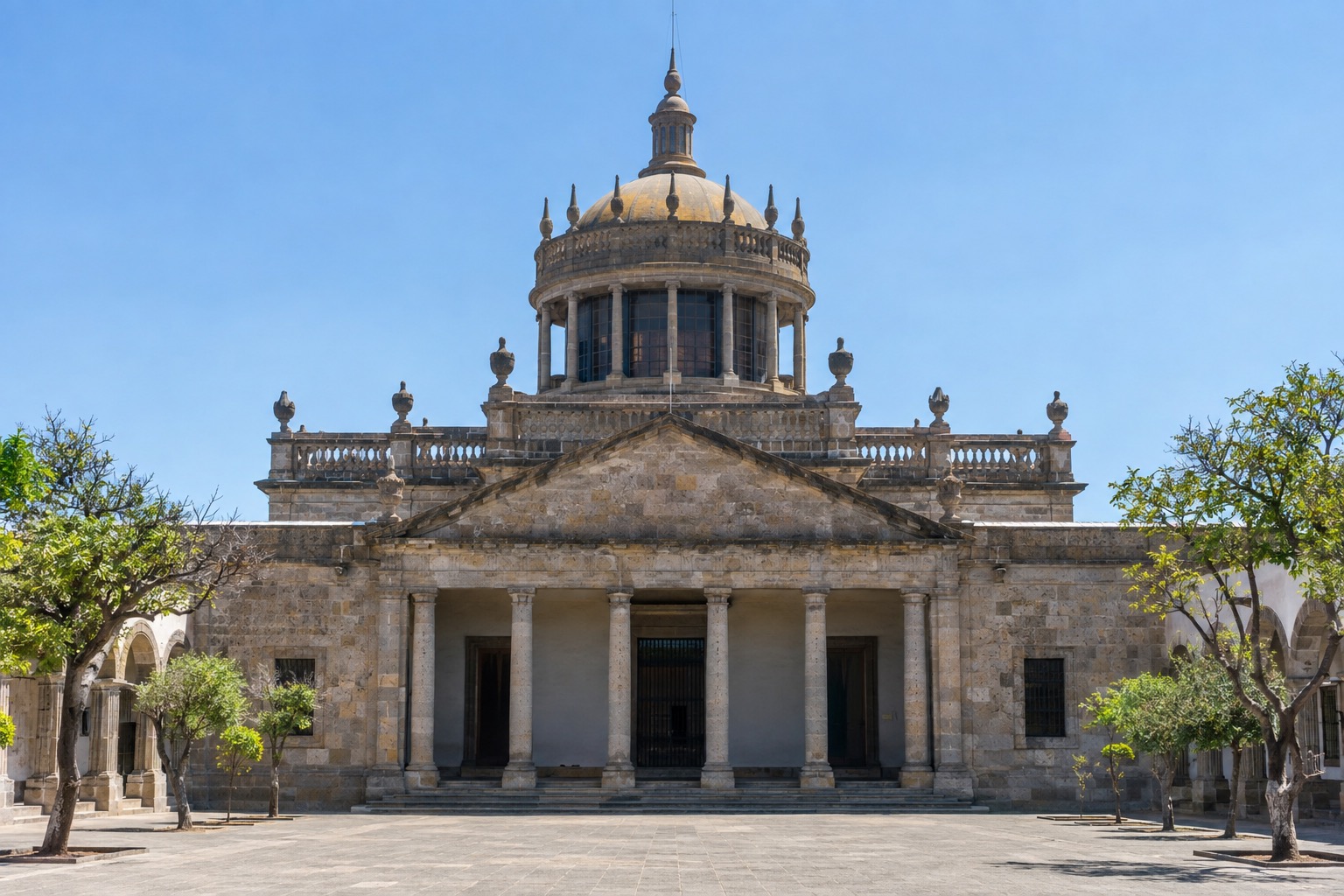 Neoclassical facade of the Hospicio Cabanas in Guadalajara under a clear sky