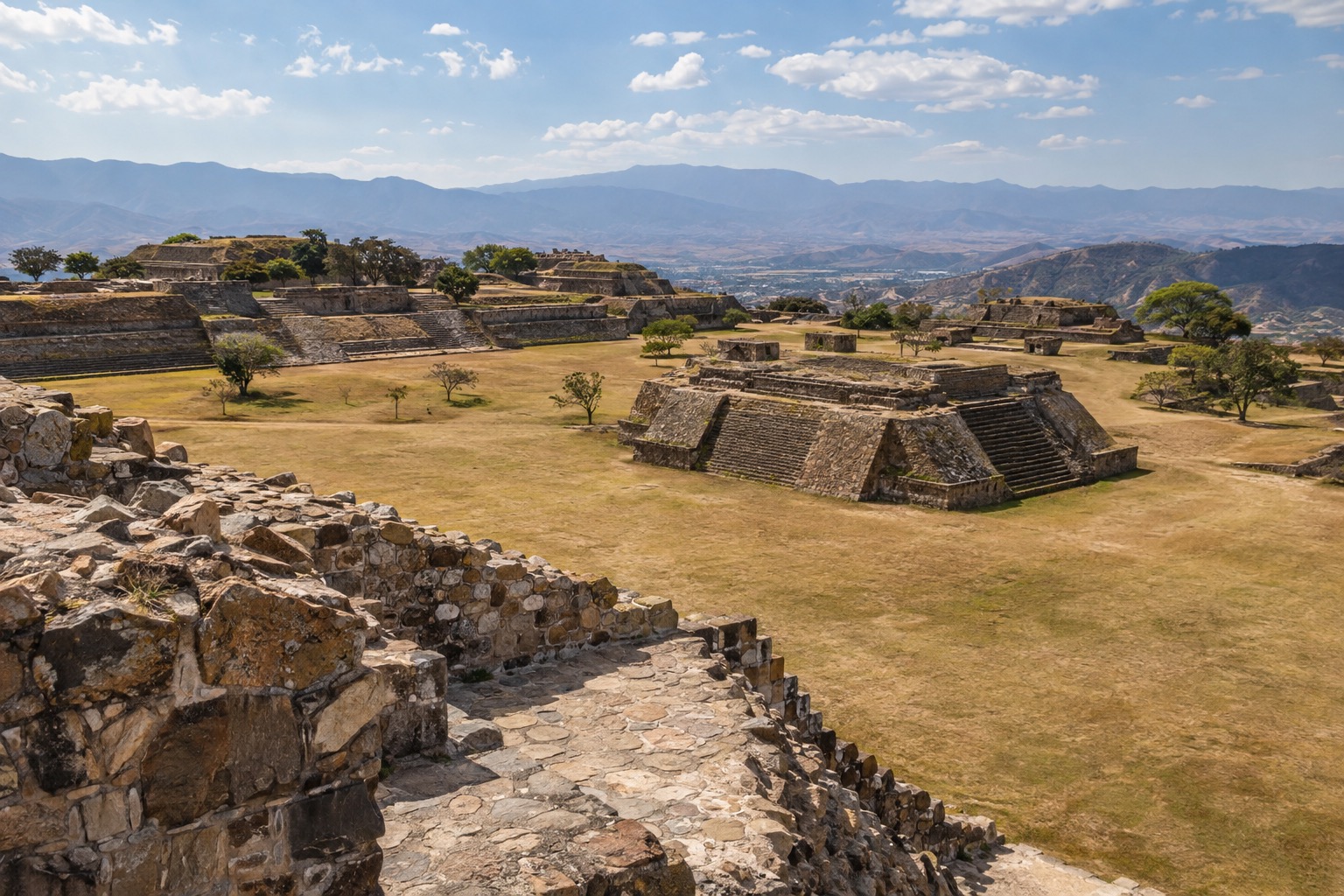 Stone platforms and stairways of the Monte Alban archaeological site on a ridge above the Oaxaca valley