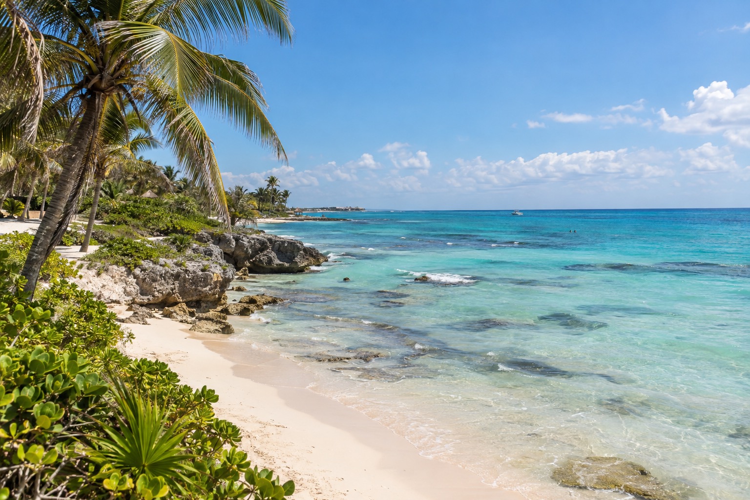 Caribbean shoreline with white sand and turquoise water at Playa del Carmen