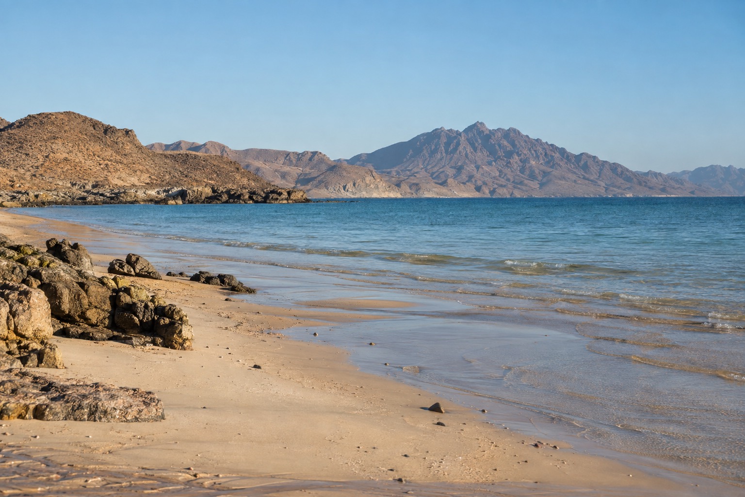 Empty sandy beach on the Sea of Cortez in low afternoon light