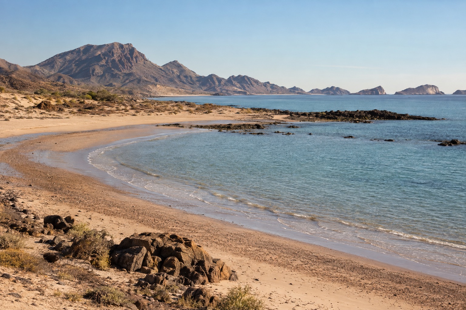 Sandy shoreline curving around a bay on the Sea of Cortez