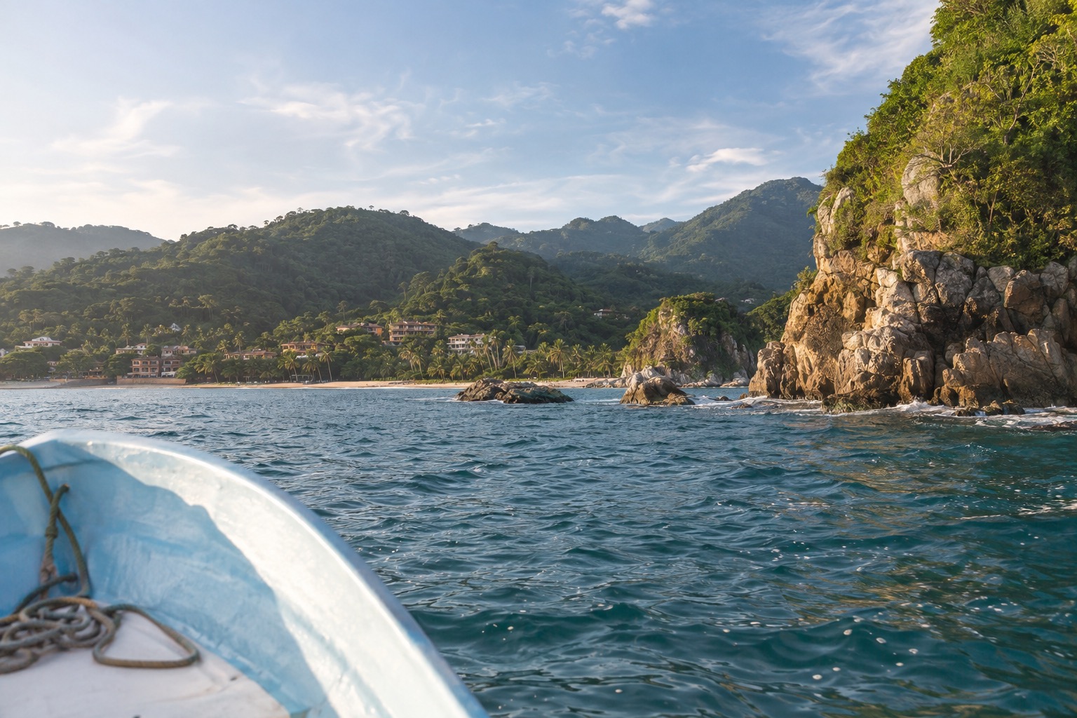 Small boat on turquoise water near a rocky island off the Nayarit coast