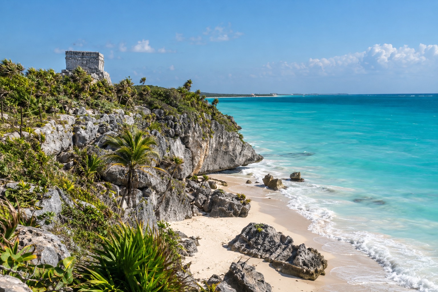 Ruined stone temple on a coastal cliff above turquoise Caribbean water