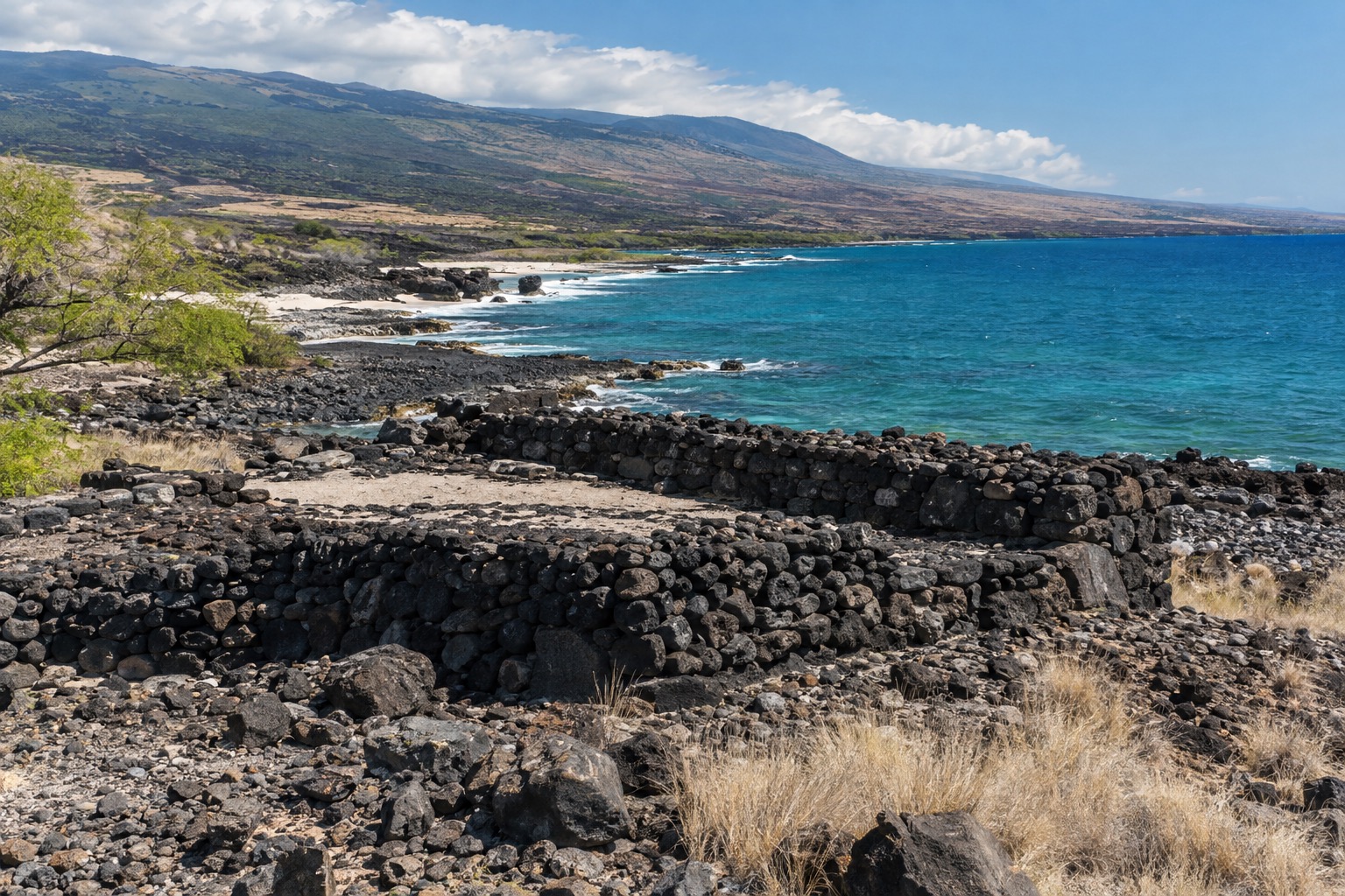 Stone platform ruins of a Hawaiian heiau on a lava coastline near Kawaihae