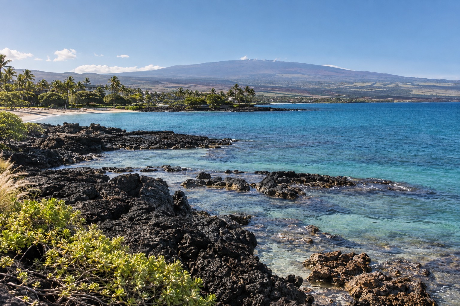 Waikoloa resort shoreline with lava rock and calm morning water in winter