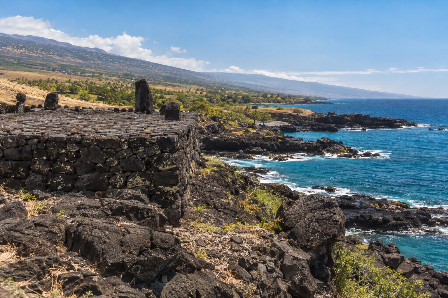 Stone platform temple ruins above a rocky Kohala coastline