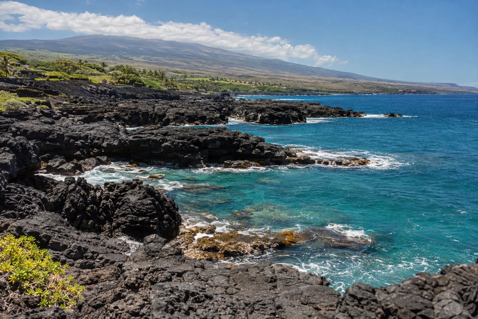 Lava rock coastline and turquoise water along the Kohala coast near Waikoloa