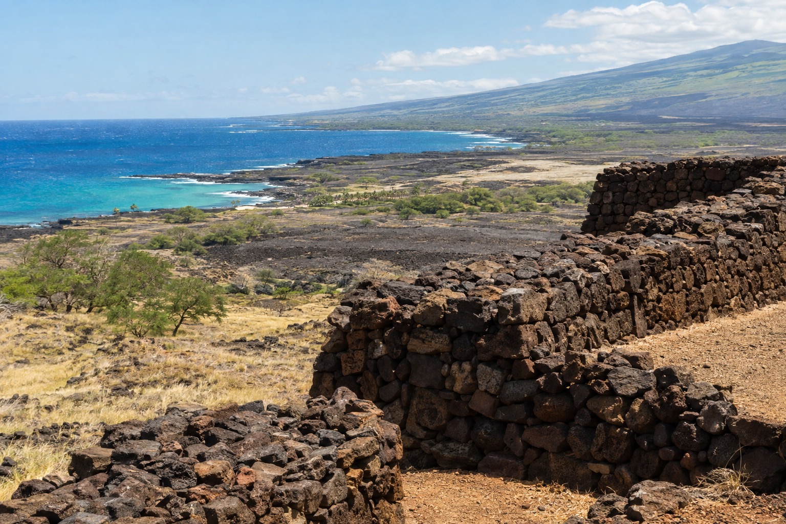 Stone platform temple walls at Puʻukoholā Heiau above the Kohala coastline