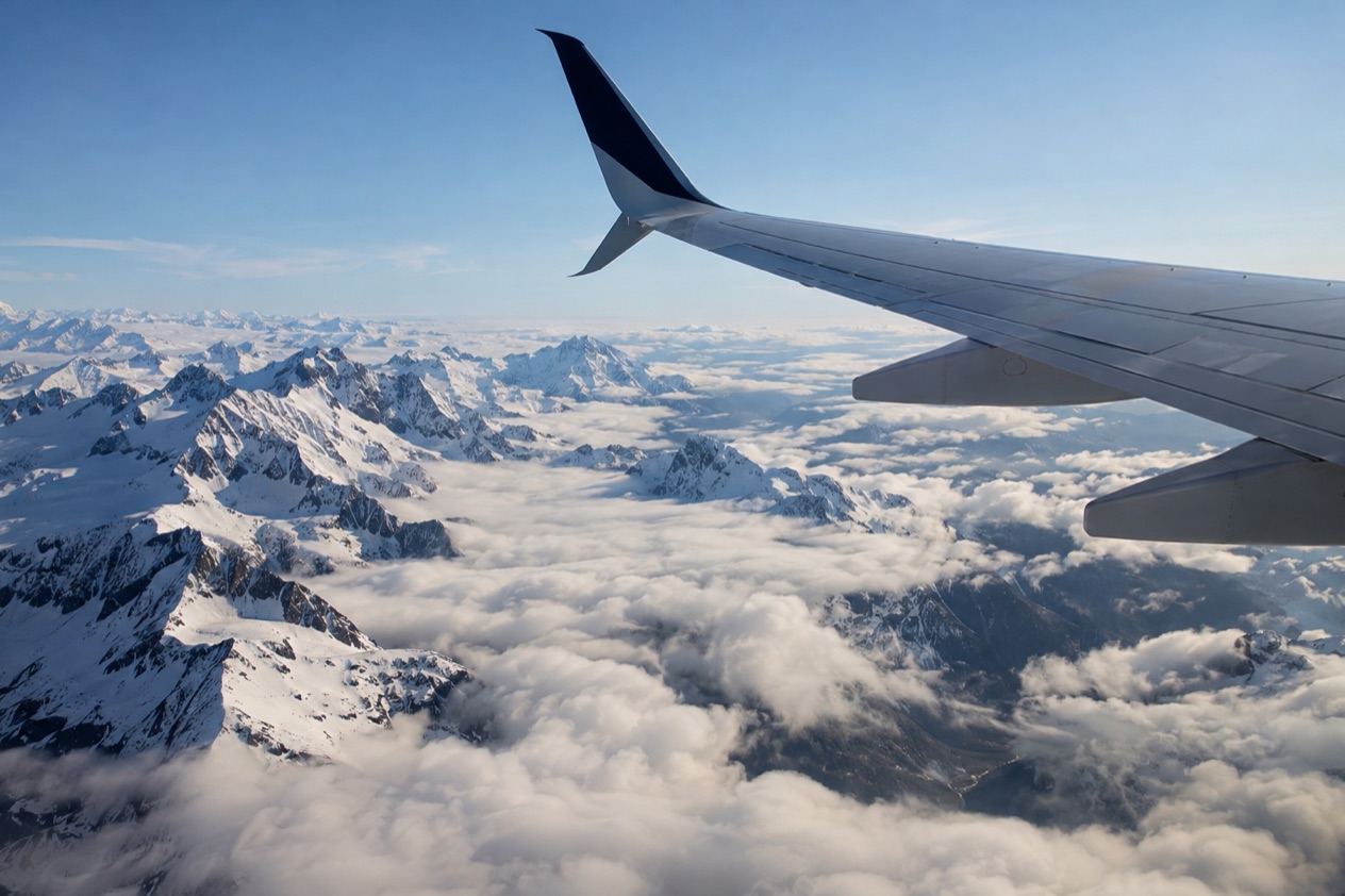A wing above the clouds