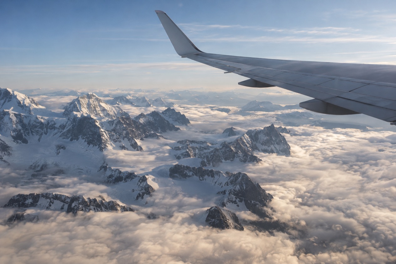 A wing above the clouds