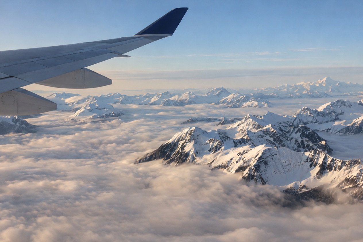 A wing above the clouds