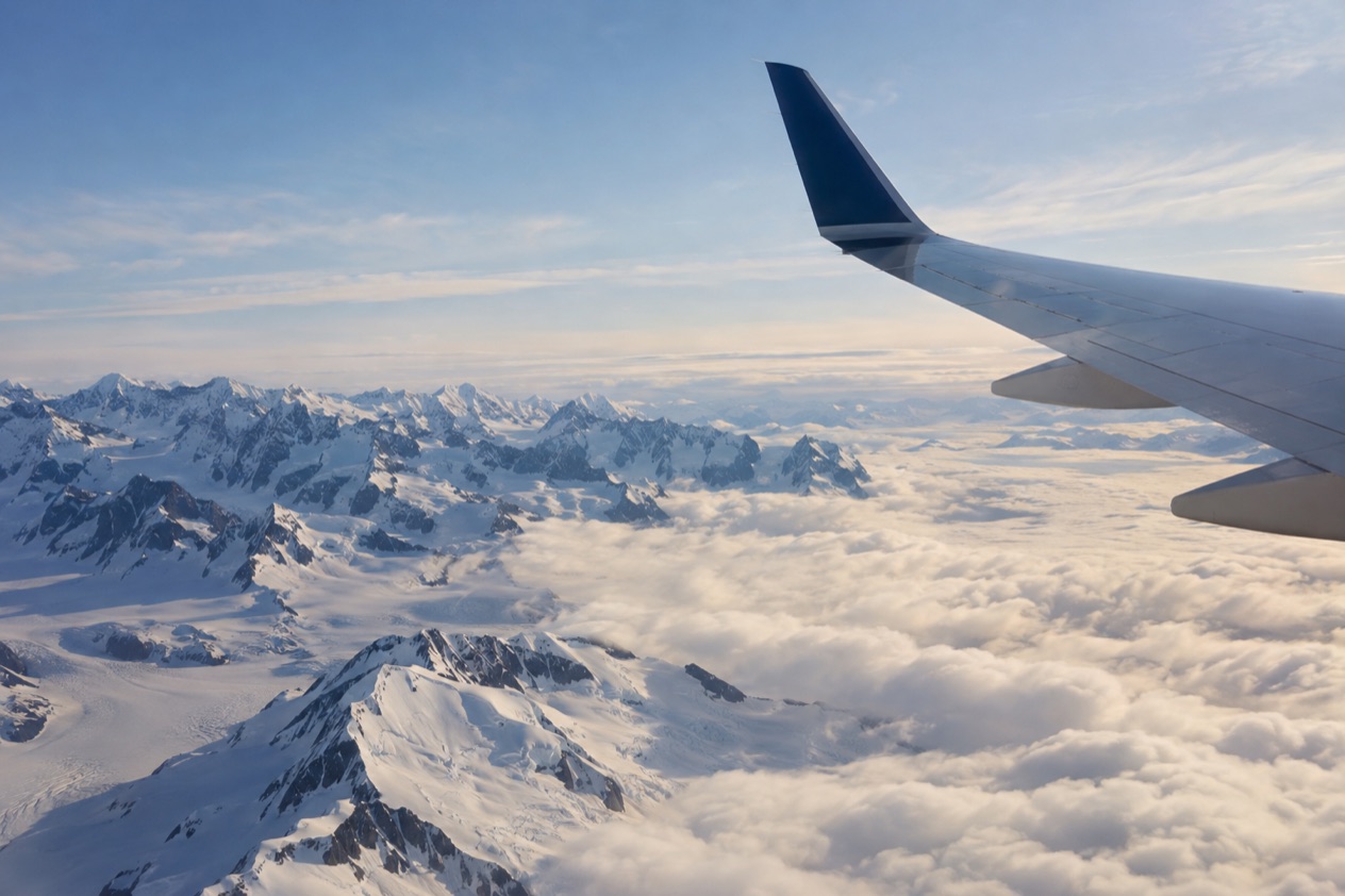 A wing above the clouds