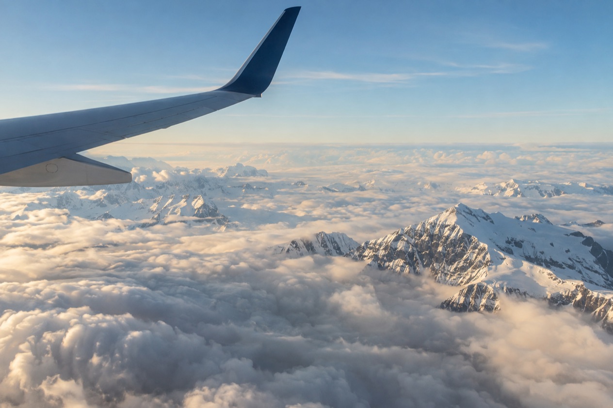 A wing above the clouds