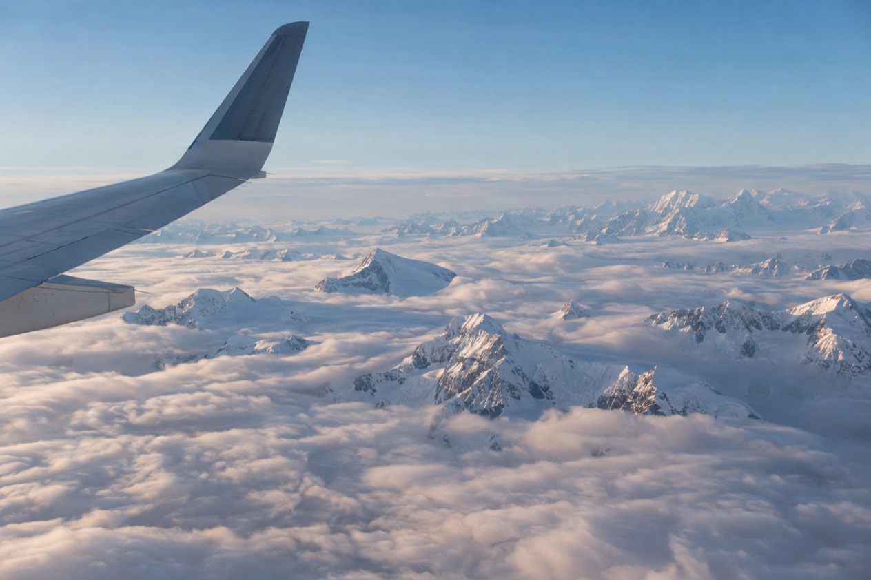 A wing above the clouds