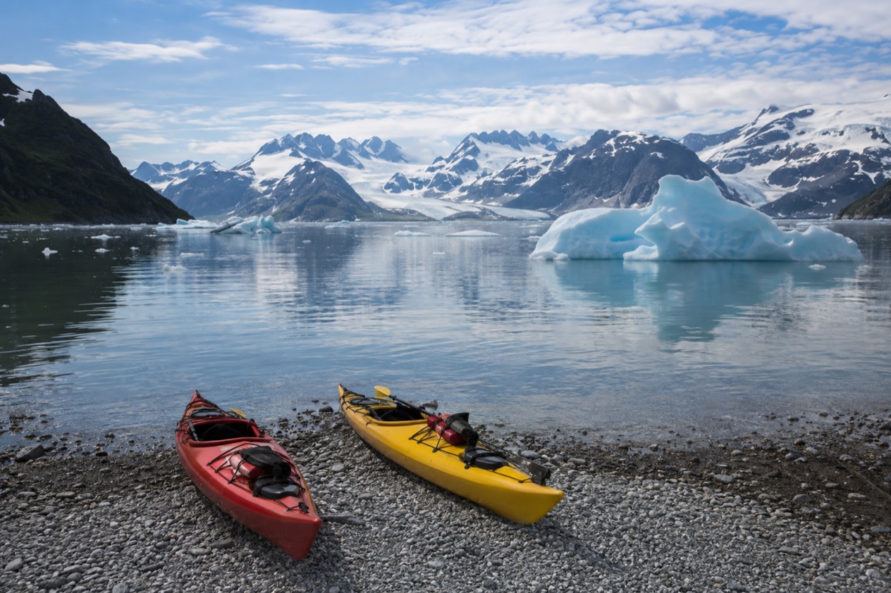 Kayaks beside a fjord