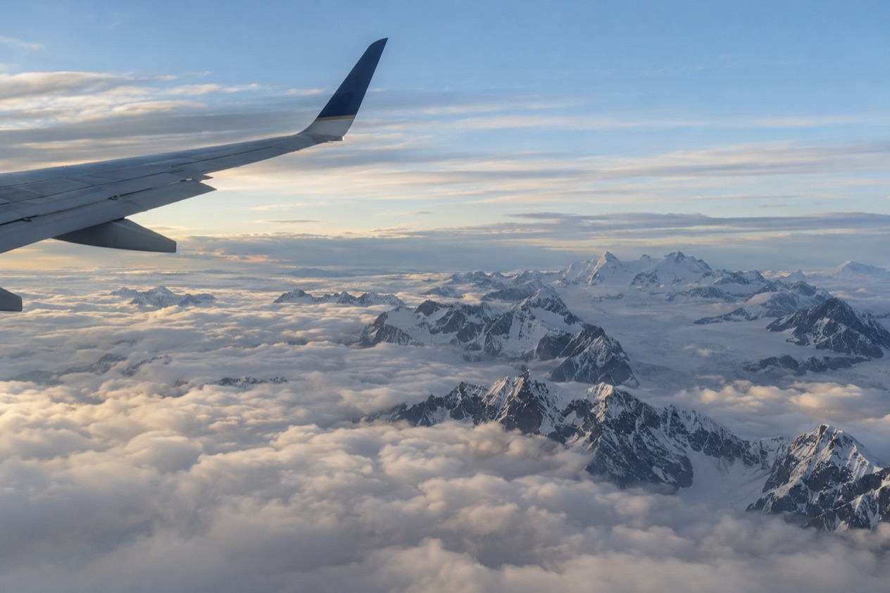 A wing above the clouds