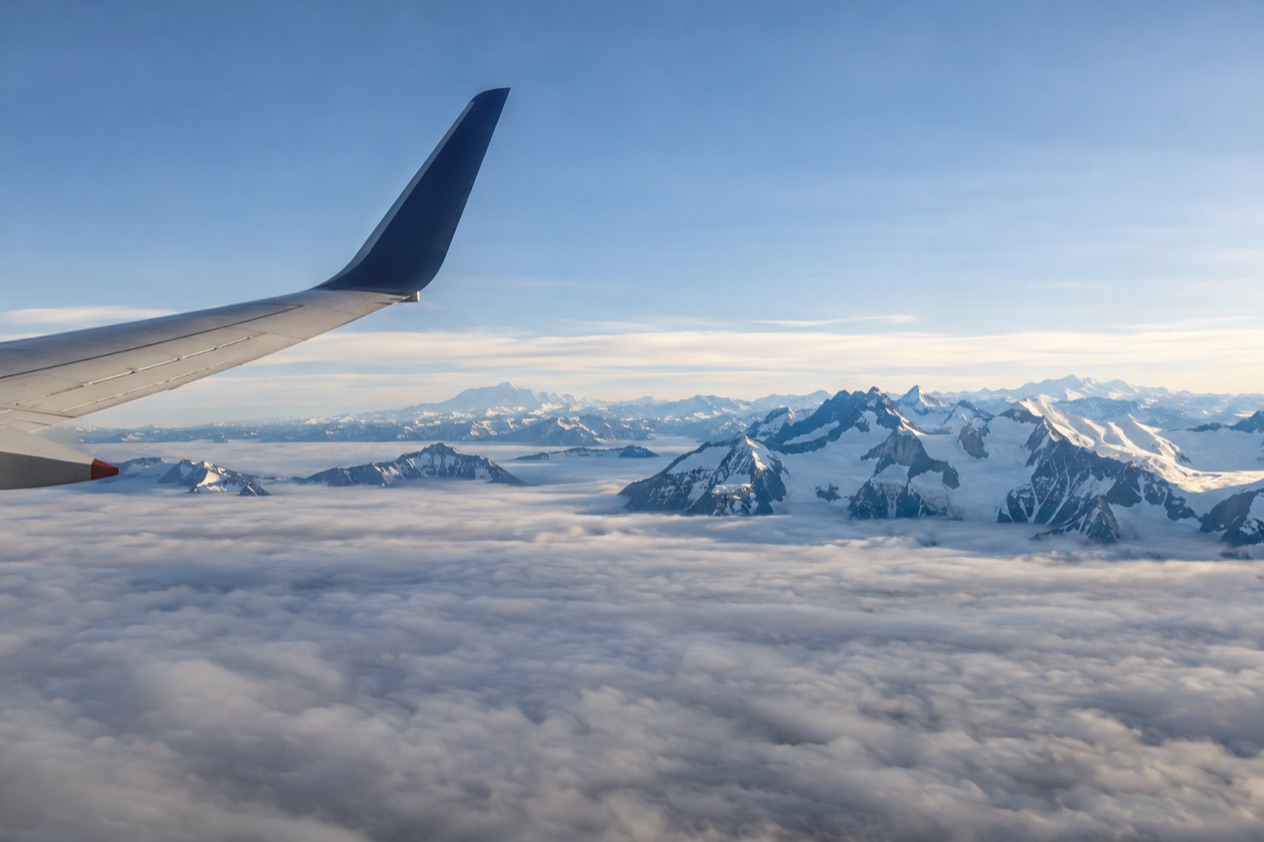 A wing above the clouds