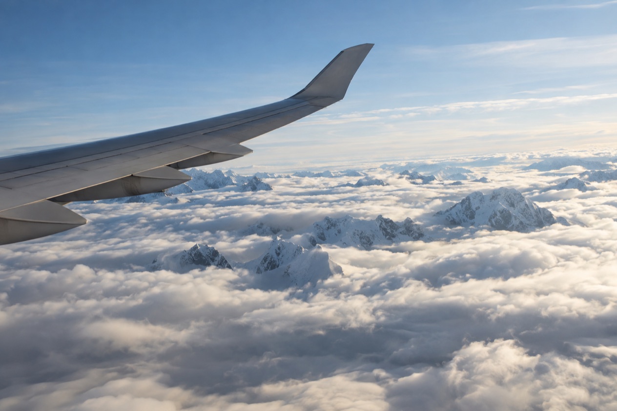 A wing above the clouds