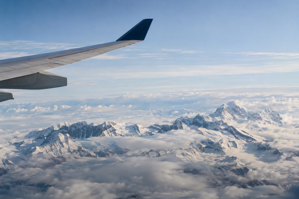 A wing above the clouds