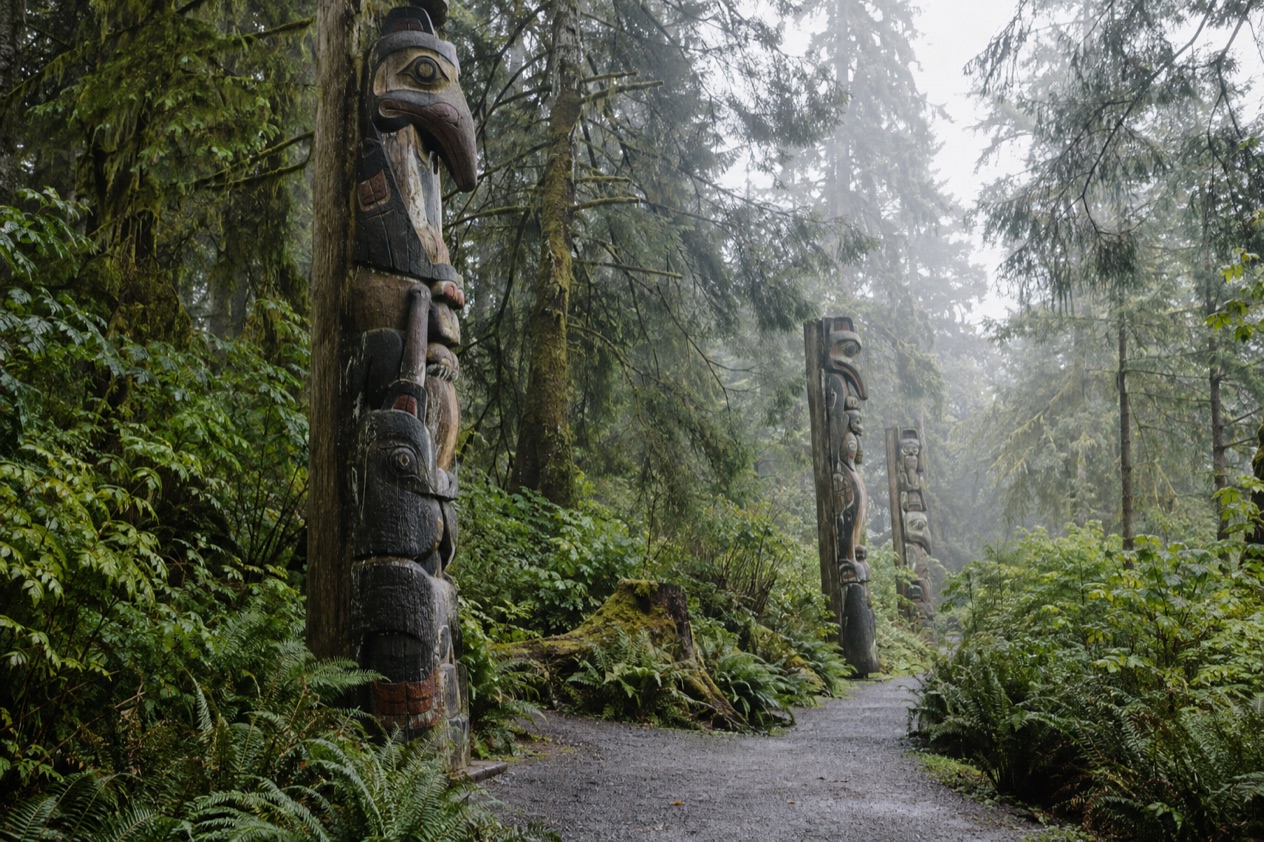 Totem poles in a rainforest