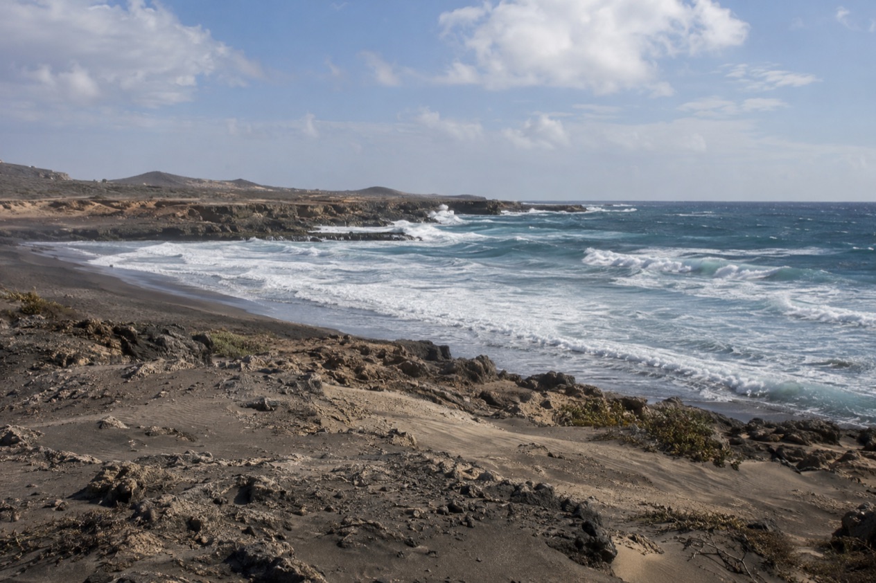 Dunes and waves at Boca Prins