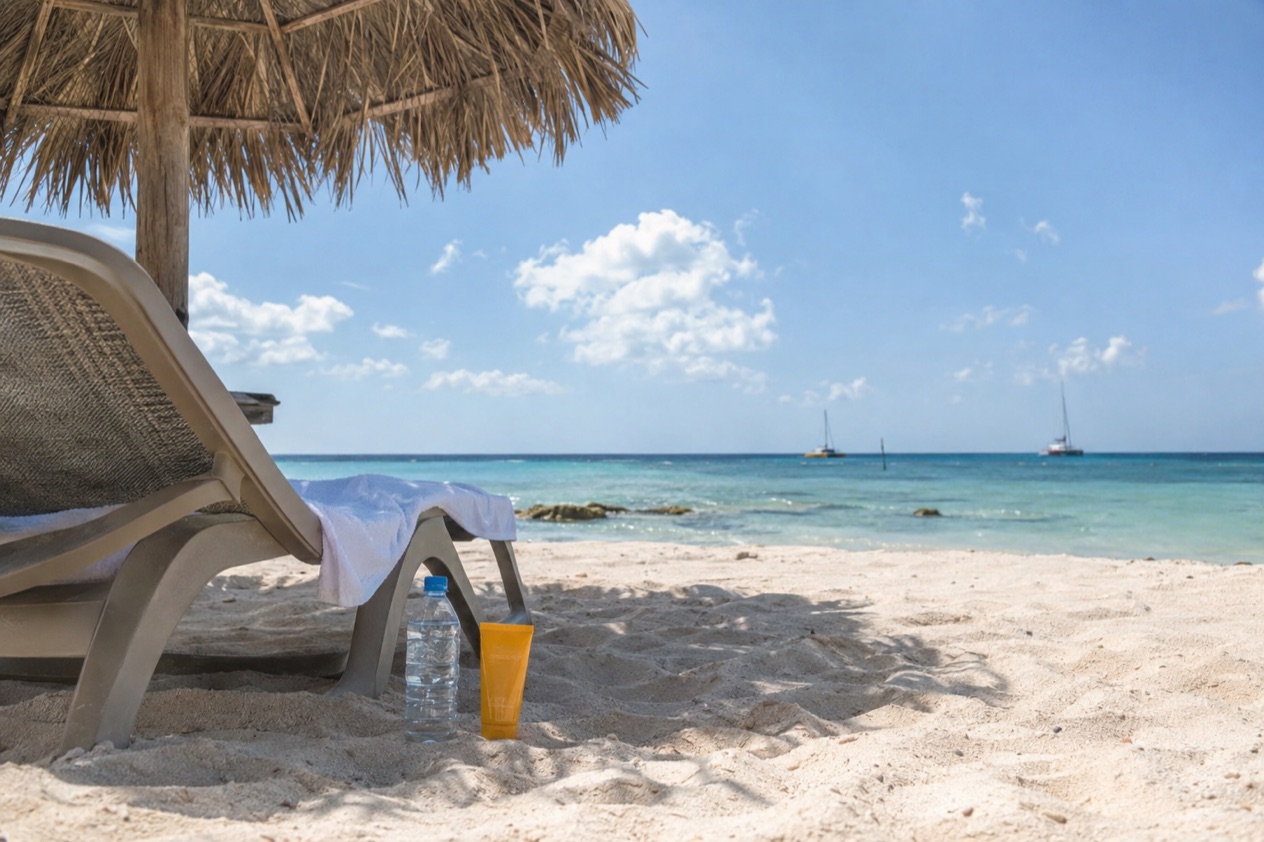 Shade, water and sunscreen on the beach