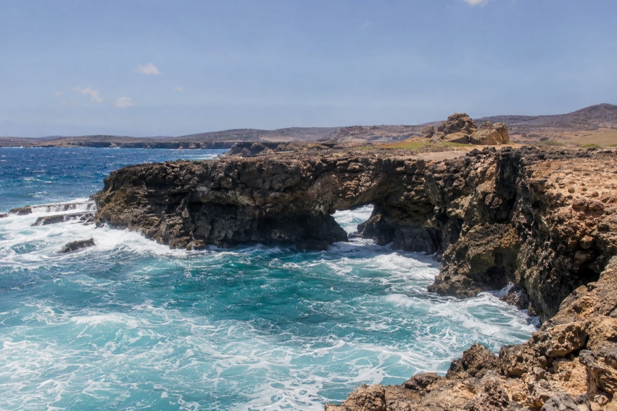 The rocky north coast with a natural arch
