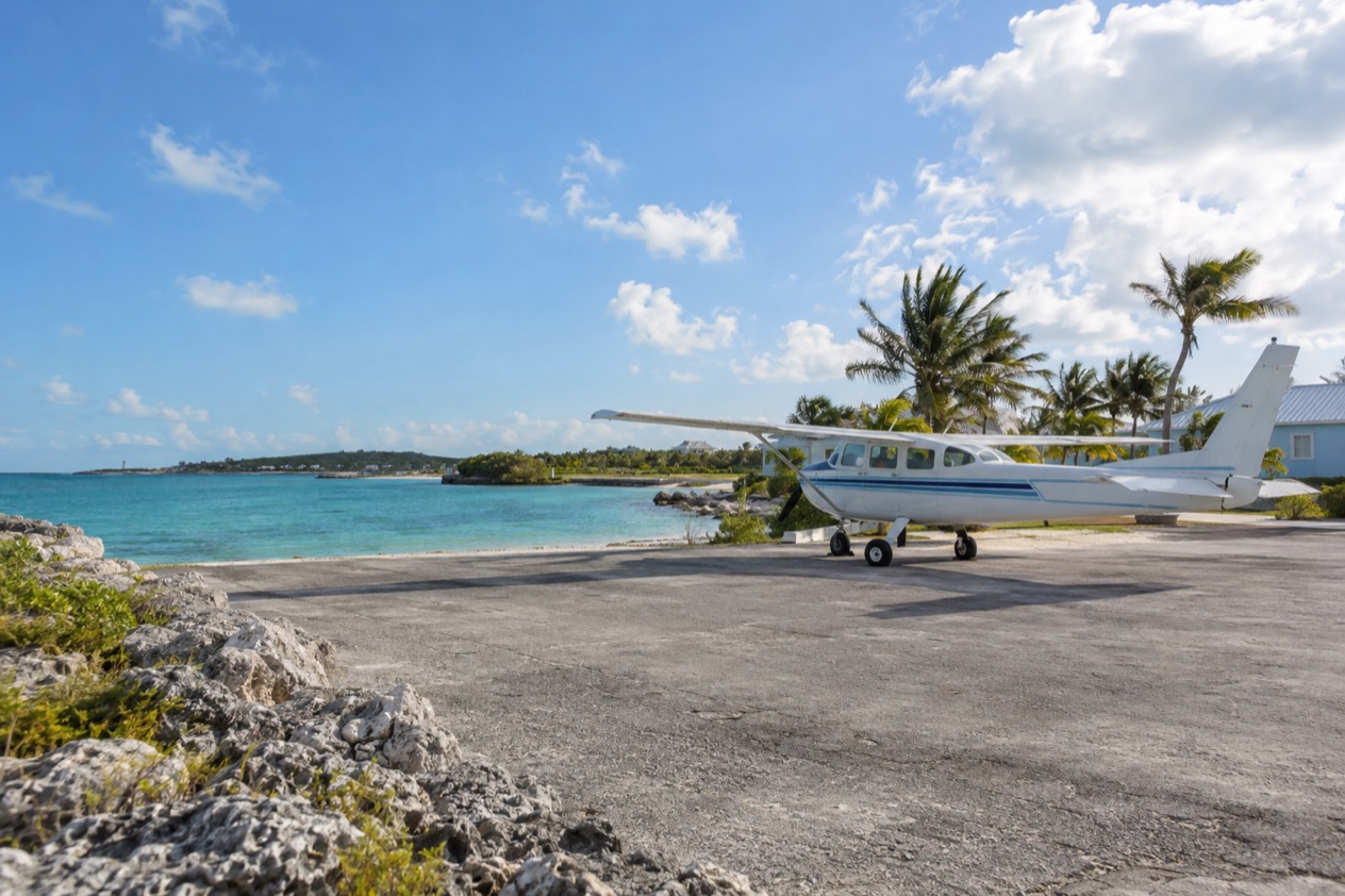 A small plane at an island airstrip