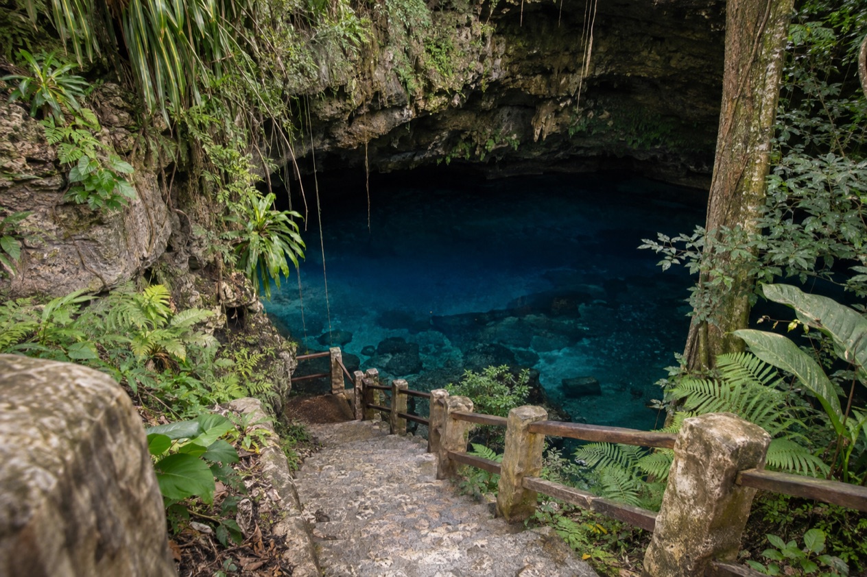 A blue hole in the forest