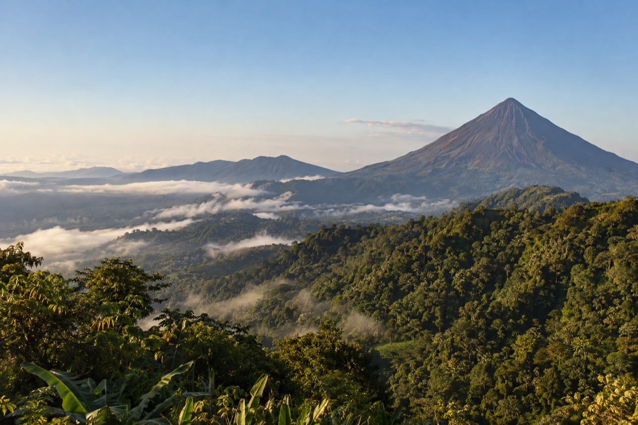 Green hills and a volcano in Costa Rica in the dry season