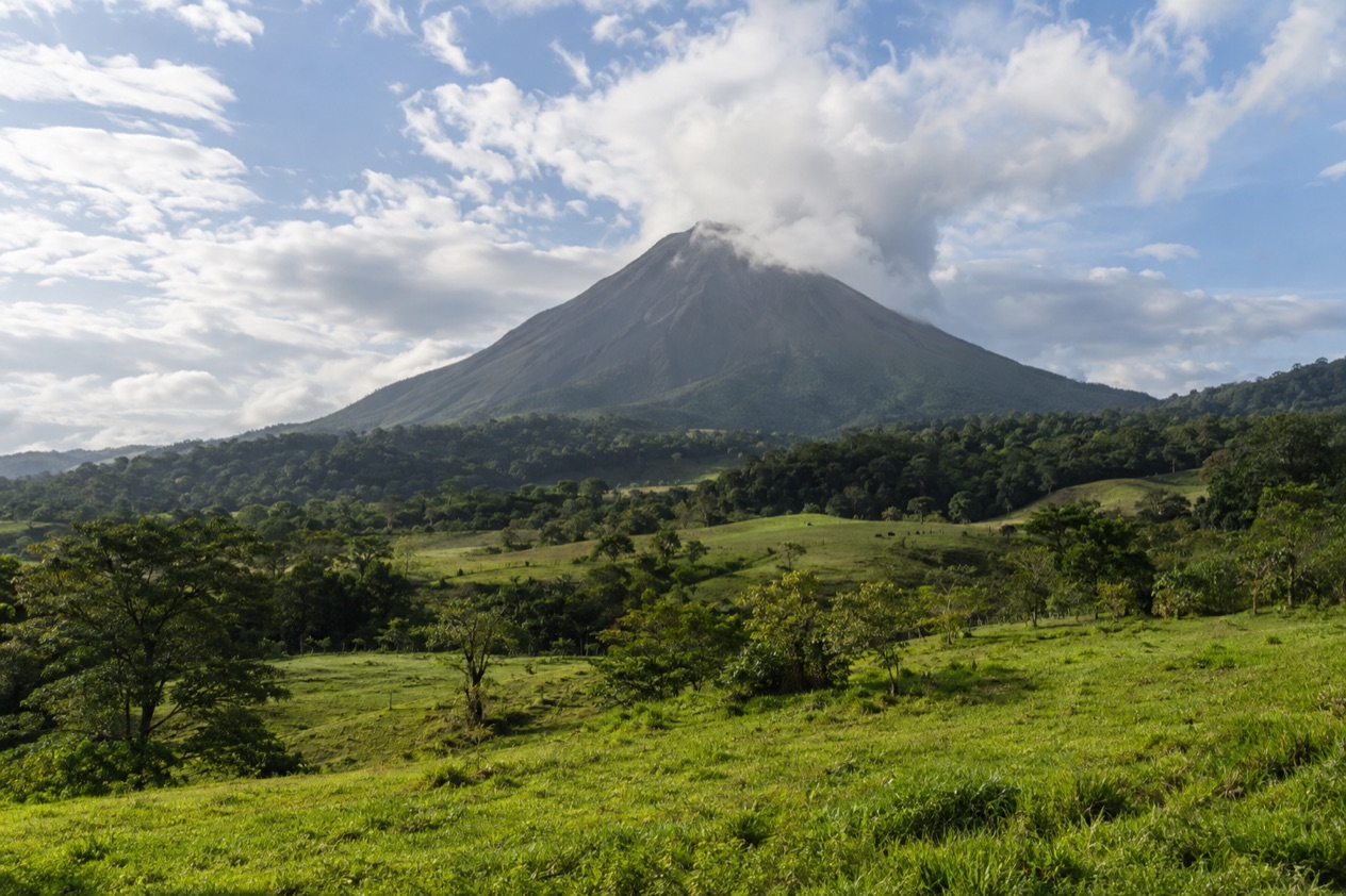 Arenal Volcano above the fields near La Fortuna