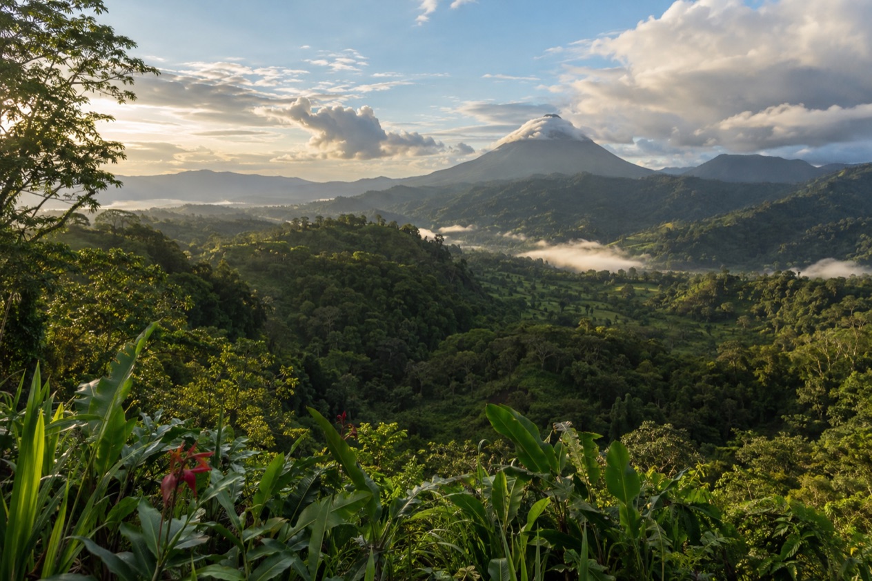 Green hills and a volcano in Costa Rica in the green season