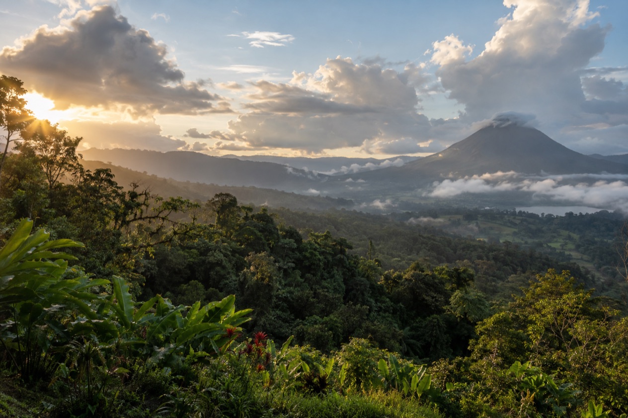 Green hills and a volcano in Costa Rica in the green season