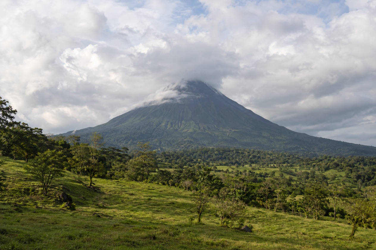 Arenal Volcano above the fields near La Fortuna