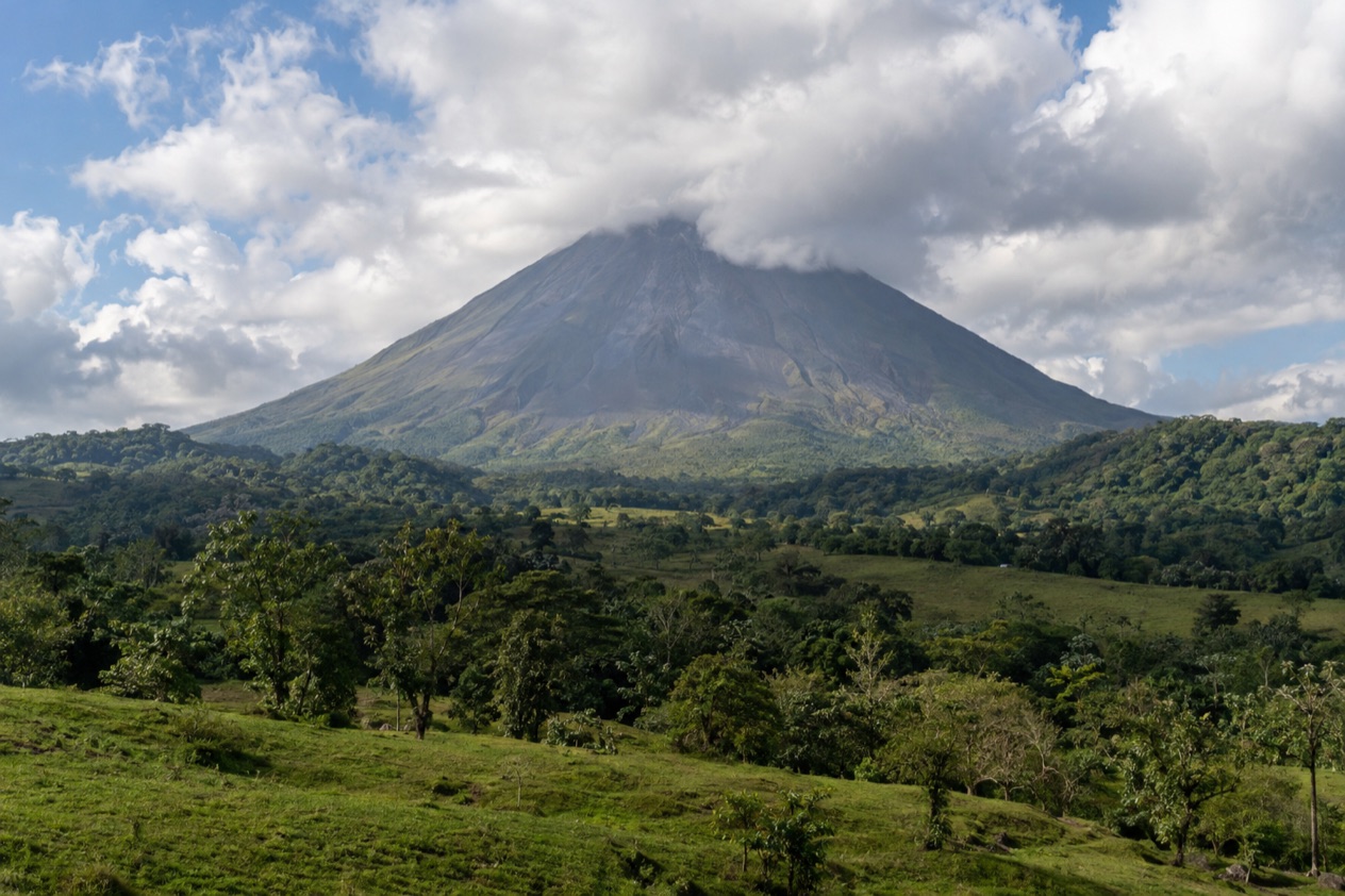 Arenal Volcano above the fields near La Fortuna