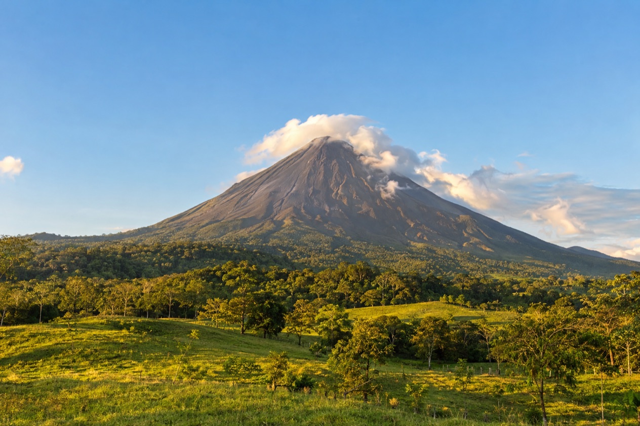 Arenal Volcano above the fields near La Fortuna in the dry season