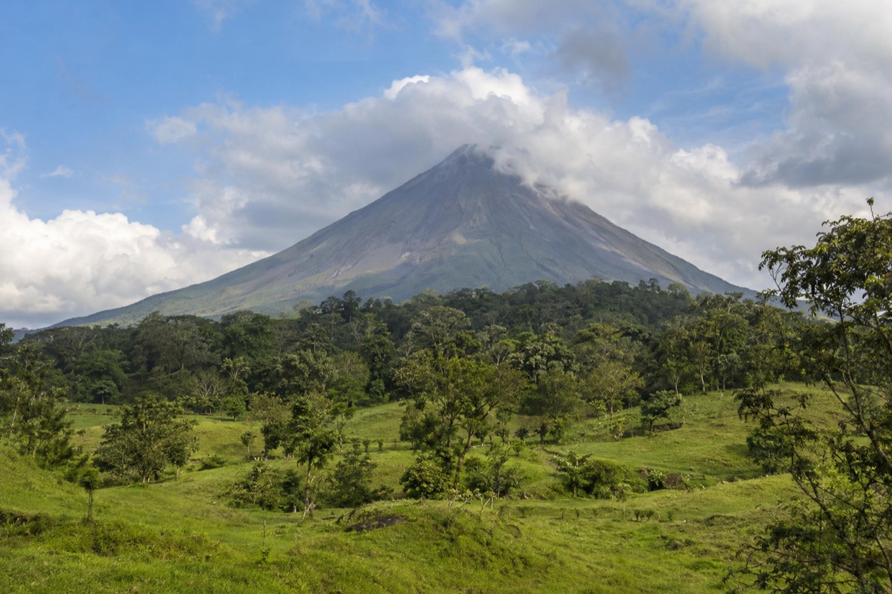 Arenal Volcano above the fields near La Fortuna